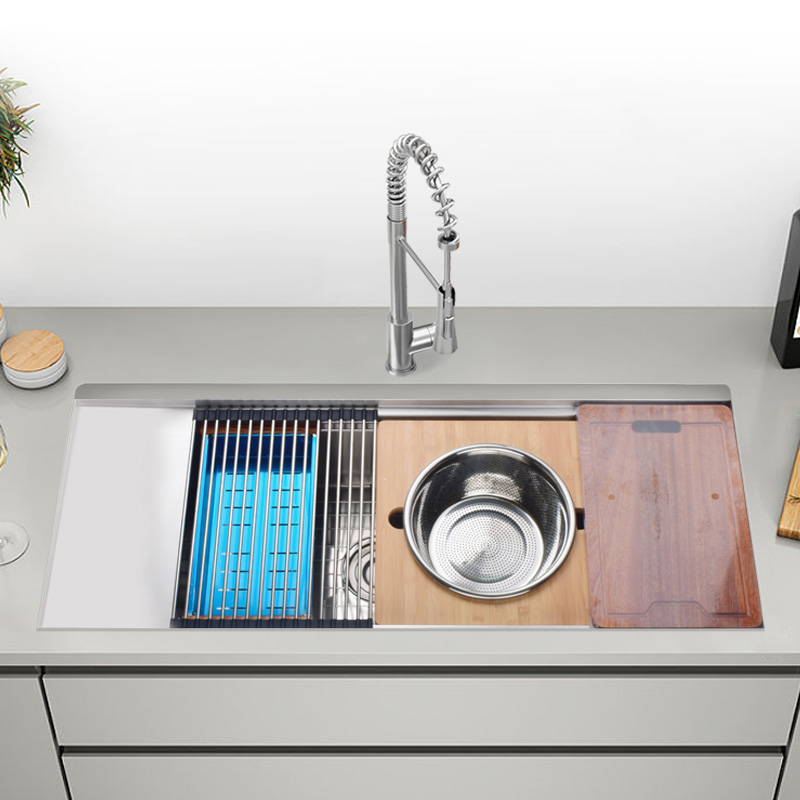 Kitchen sink with cutting board and drain